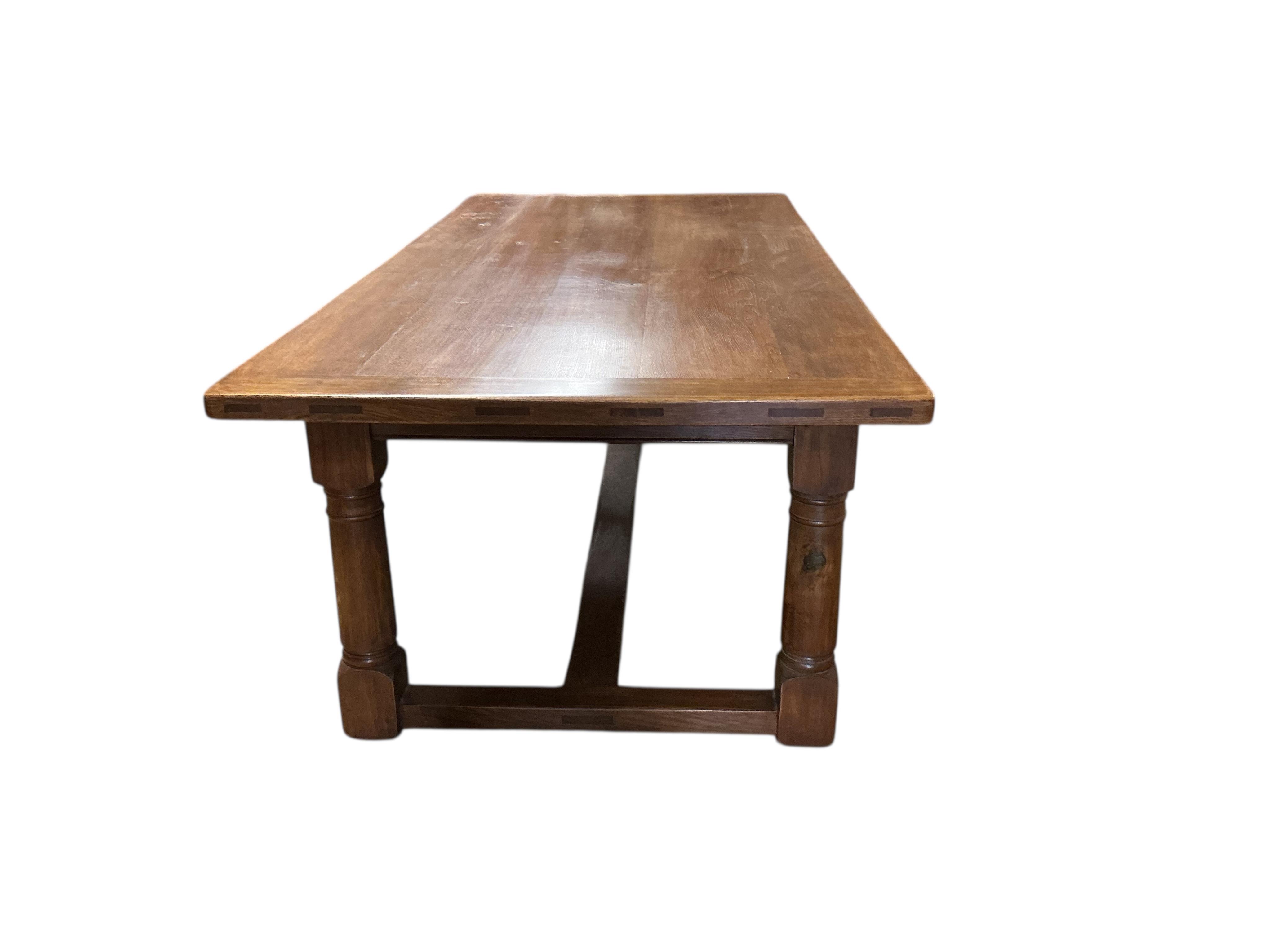 An 18th century style rectangular oak refectory dining table, width 229cm, depth 107cm, height 78cm